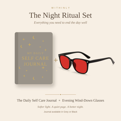 The Night Ritual Set — the grey Daily Self Care Journal alongside the black Evening Wind-Down Glasses with red-tinted lenses.